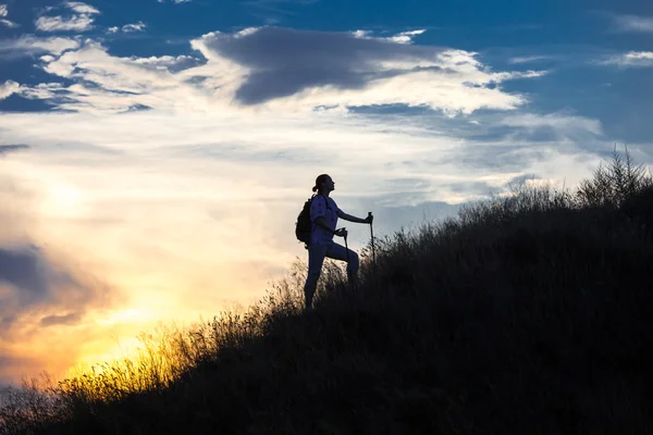 depositphotos 69888799 stock photo female hiker walks along the